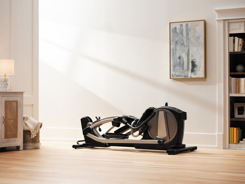 Nordic Track SE7i Elliptical Trainer. Image of the cross trainer folded down in a room in a domestic setting.