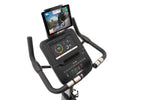 Spirit XBU55 ENT Upright Bike with Touch Console showing angled view of console with tablet in tablet holder and downloaded app on tablet.