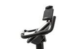 Spirit XBU55 ENT Upright Bike with Touch Console with tablet holder slightly swivelled.