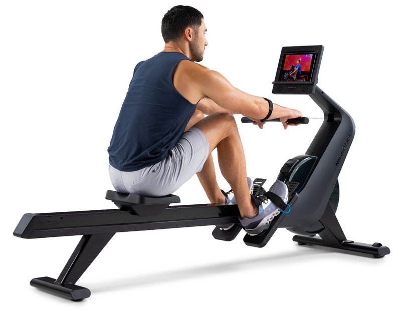 NEW Nordic Track RW300 Rower with male rower in studio using tablet on tablet shelf