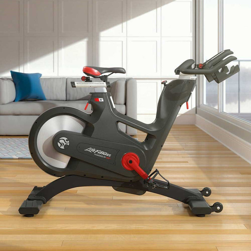 Side view of the Life Fitness IC7 indoor bike in a home setting,  Fitness Options. Nottingham's leading fitness & gym equipment supplier