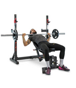 Male doing incline bench press on the BH Olympic Rack Light Commercial Bench G510