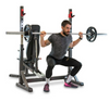 Male doing squats at the rear of the BH Olympic Rack Light Commercial Bench G510