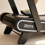 Close up of front of Bodytone ZROT4 Light Commercial Curved Treadmill with persons foot showing