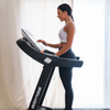 Bodytone DT22W TFT Treadmill with woman standing on treadmill using console