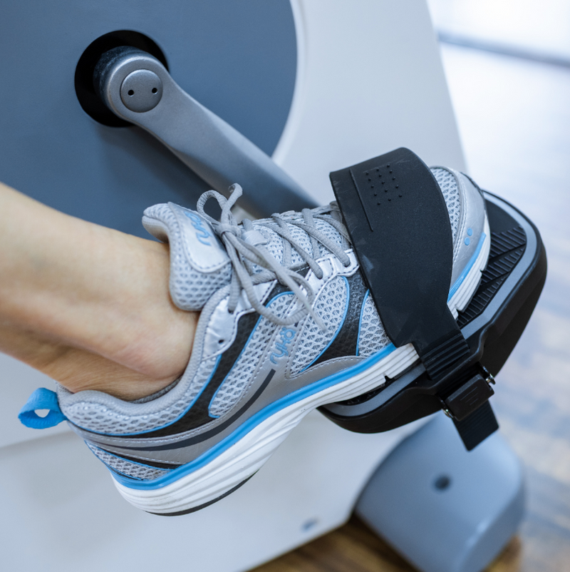 Dyaco Medical Physical Therapy Recumbent Bike 4.0R with close up of pedal with patients foot placed in pedal strap.