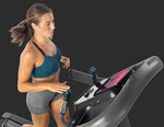 Horizon 7.4AT treadmill with female runner using easy dial speed and incline controls