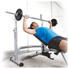 Horizon Adonis bench with male bench pressing barbell after lifting it off rack