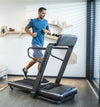 Horizon Omega Z @Zone Treadmill with male runner in room setting 