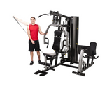 Horizon Torus 5 Gym with male model performing lateral raise