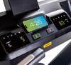 Close-up of Inspire Fitness T7S treadmill control panel with digital displays and buttons.