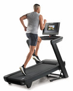 Nordic Track 1250 Treadmill with male running on incline in studio