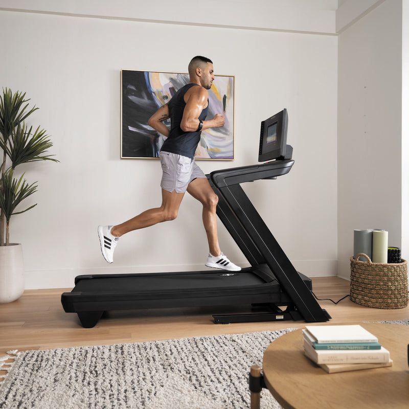 Nordic Track 1250 Treadmill with male running in room setting