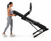 Nordic Track EXP 10i Treadmill with female moving it on its transport wheels in stidio