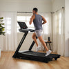 Nordic Track EXP 5i Treadmill with male runner in room