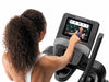 Nordic Track Freestrider Trainer FS10. Image showing a female using the touch screen console.