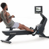 Nordic Track RW700 Rower. Male rowing on the machine whilst in a programme.