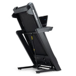 NordicTrack Commercial LE Treadmill folded against white background.