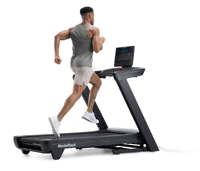 NordicTrack Commercial LE Treadmill with man running against white background