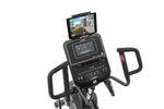  Spirit XE295 Elliptical trainer.  An image of the console and tablet holder. The tablet is in use showing a man running down a road.