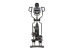  Spirit XE295 Elliptical trainer. A view of the machine taken from the rear, showing handle bars, footplates, console and tablet holder.