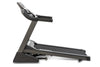 Spirit XT185 Treadmill side view showing running deck in incline position.