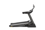 Spirit XT485 ENT Treadmill with Touch Screen inclined viewed from the side.