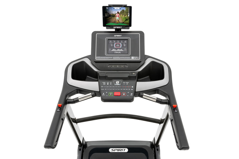 Spirit XT485 Treadmill showing tablet holder with tablet and downloaded app, black LCD screen, incline and speed buttons, hand grip pulse, fan and incline and speed toggles on handlebars.