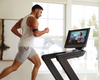 Nordic Track Commercial 2450 Treadmill  with close up of male running on the treadmill