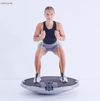 New Icaros Cloud 360 with female model squatting using the bungees as resistance over the shoulders.