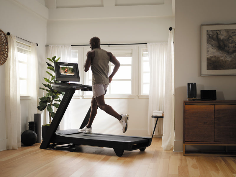 Nordic Track 1750 Treadmill. Male running on the treadmill in a domestic setting.