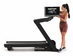 Nordic Track 1750 Treadmill. A view of a female demonstrating how the console can be placed at different angles.