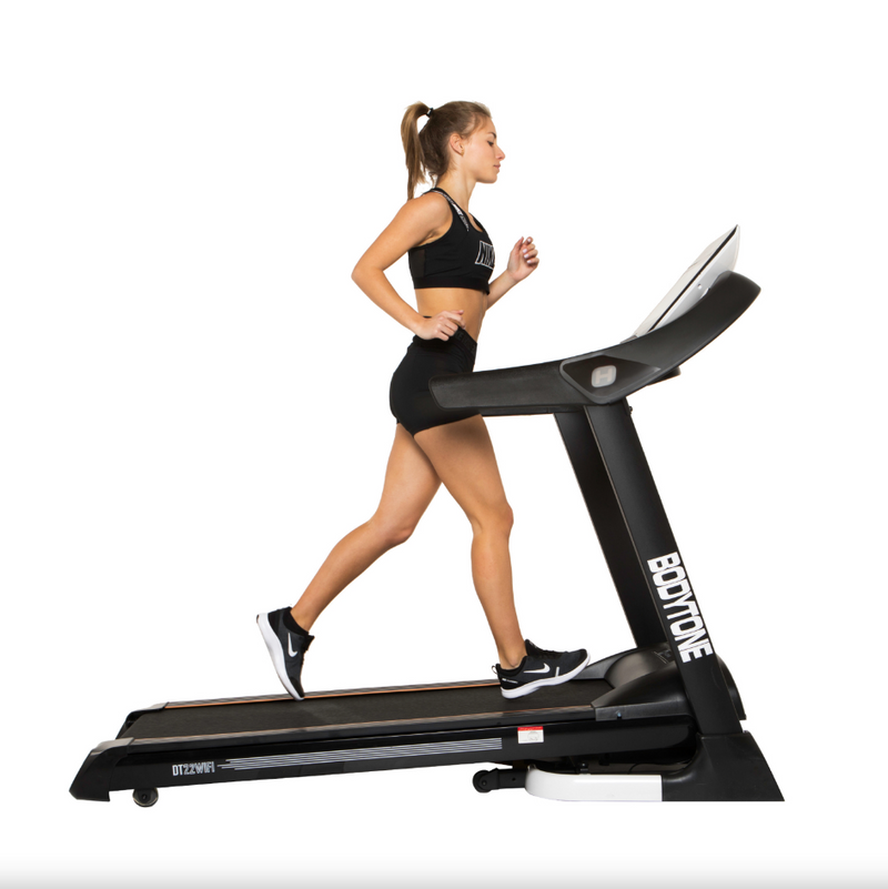 Woman running on a Bodytone DT22W TFT Treadmill  with 'Bodytone' branding on a white background
