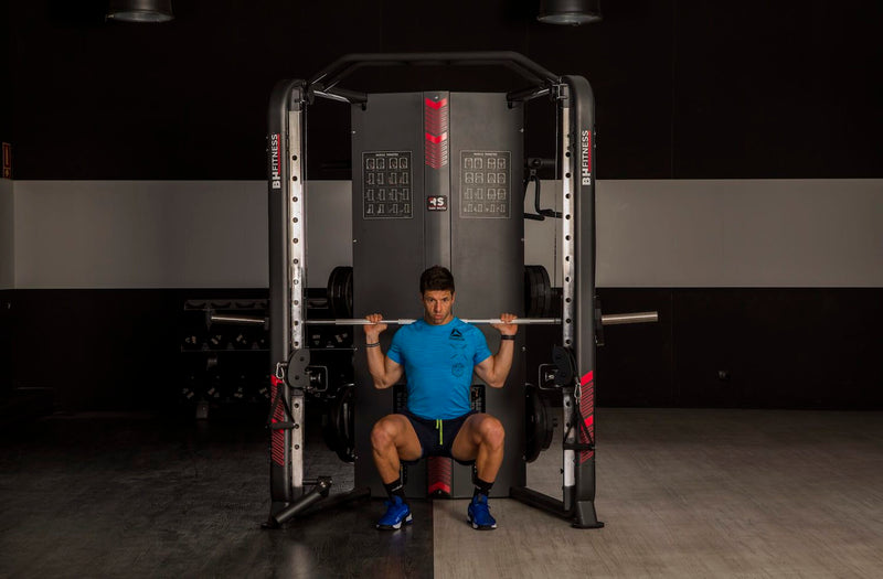 An image of a man working out on the BHG160 Rack Smith performing a squat exercise. Fitness Options. Nottingham's leading fitness & gym equipment supplier.