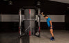 Image of male using the Landmine Core Trainer on the BH G160 Rack Smith