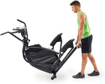 Image of a man moving the Horizon HT5.0 Peak Trainer using the transport wheels at the front of the machine.  Fitness Options, Online Gym Equipment Supplier and Nottinghamshire Showroom