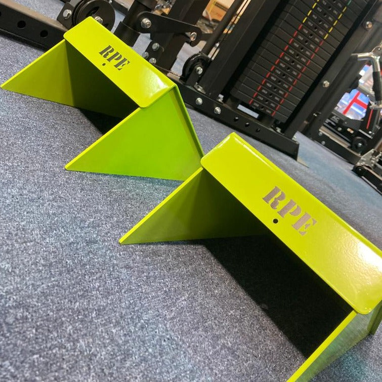 RPE Squat Wedges in our showroom - for sale in the UK. Designed to get deeper into squats to develop more muscle and strength in the legs and lower body. Find and buy fitness equipment from one of Nottingham's largest equipment suppliers.