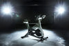 Image showing the Spirit Johnny G Bike floodlit by spot lights.  Fitness Options, Online Gym Equipment Supplier and Nottinghamshire Showroom  