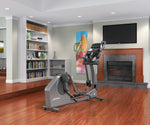 Image of the Life Fitness E3 Cross Trainer in a home setting.  Fitness Options. Nottingham's leading fitness & gym equipment supplier.