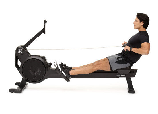 Image taken from the side of a male working out  on a Life Fitness Heat Rower. Fitness Options, Online Gym Equipment Supplier and Nottinghamshire Showroom