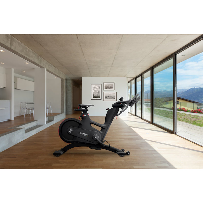 Image of the Life Fitness Indoor cycle in a home setting.  Fitness Options. Nottingham's leading fitness & gym equipment supplier.