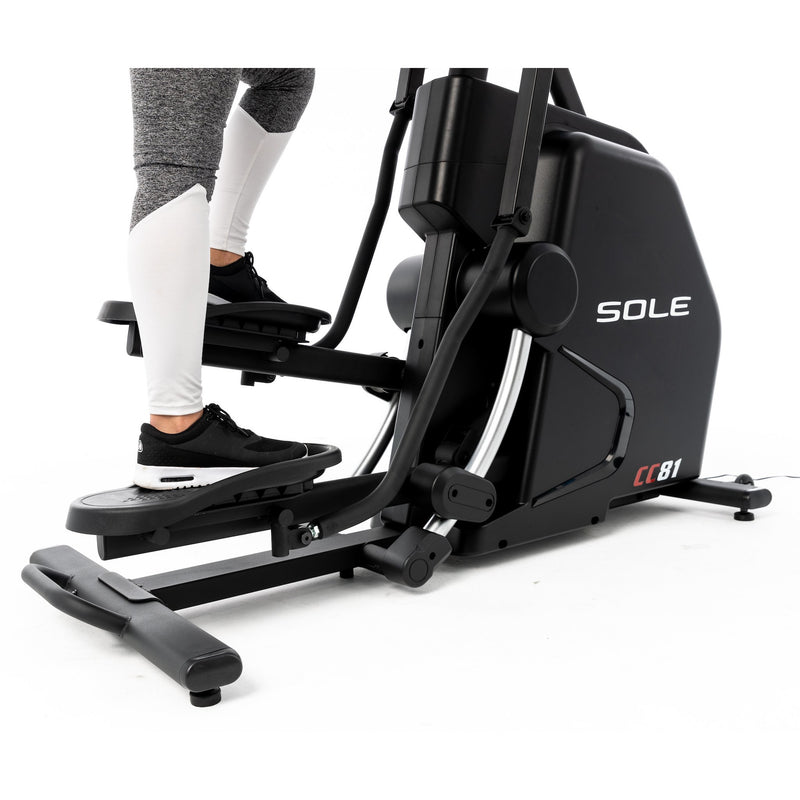  Side view of the lower part of Sole CC81 Climber  and the feet of a female model as she steps up and down. Fitness Options, Online Gym Equipment Supplier and Nottinghamshire Showroom