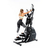 Female model on the Sole CC81 Climber slightly angled so you can see more of the rear of the machine where you mount the foot plates. Fitness Options, Online Gym Equipment Supplier and Nottinghamshire Showroom