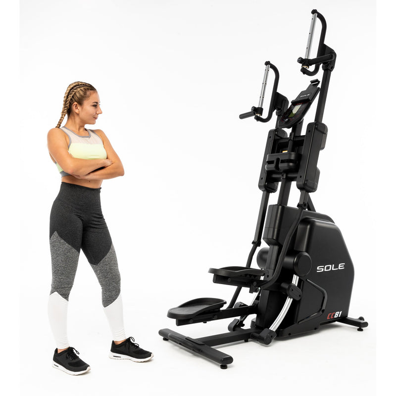 Female model with arms folded standing behind the Sole CC81 Climber. Fitness Options, Online Gym Equipment Supplier and Nottinghamshire Showroom